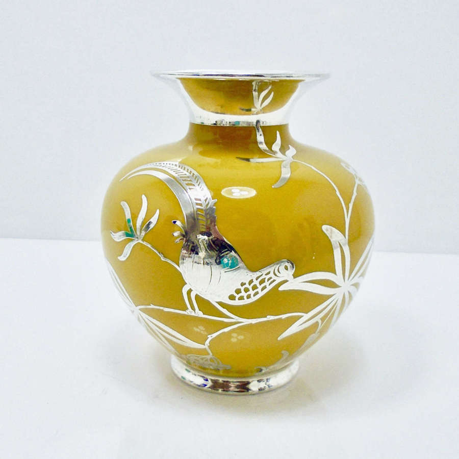 A Yellow &ndash; mustard ground vase decorated with birds in silver overlay.