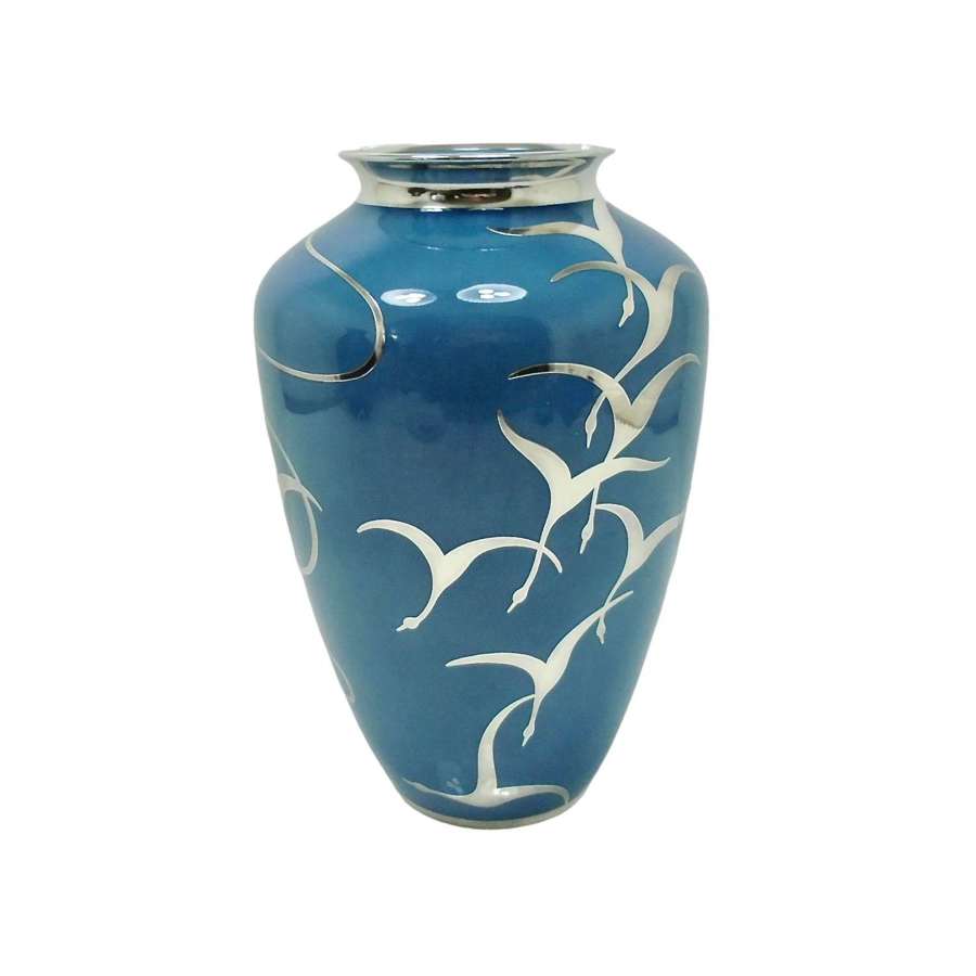 An exciting and rare silver overlay vase