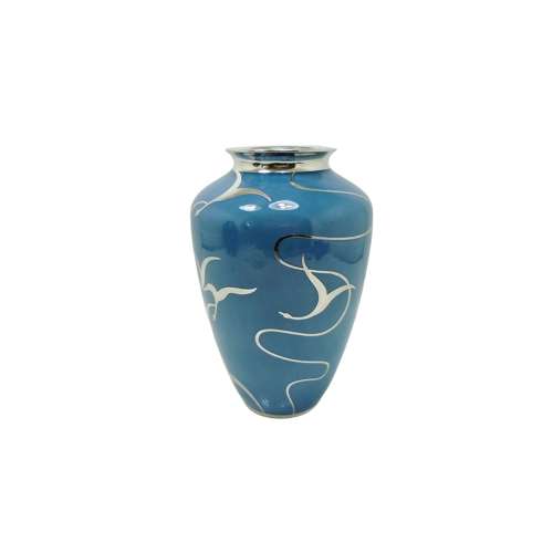 An exciting and rare silver overlay vase