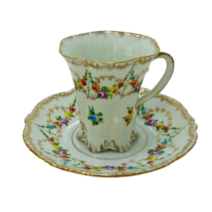 A Versailles shape Donath Dresden decorated chocolate cup & saucer